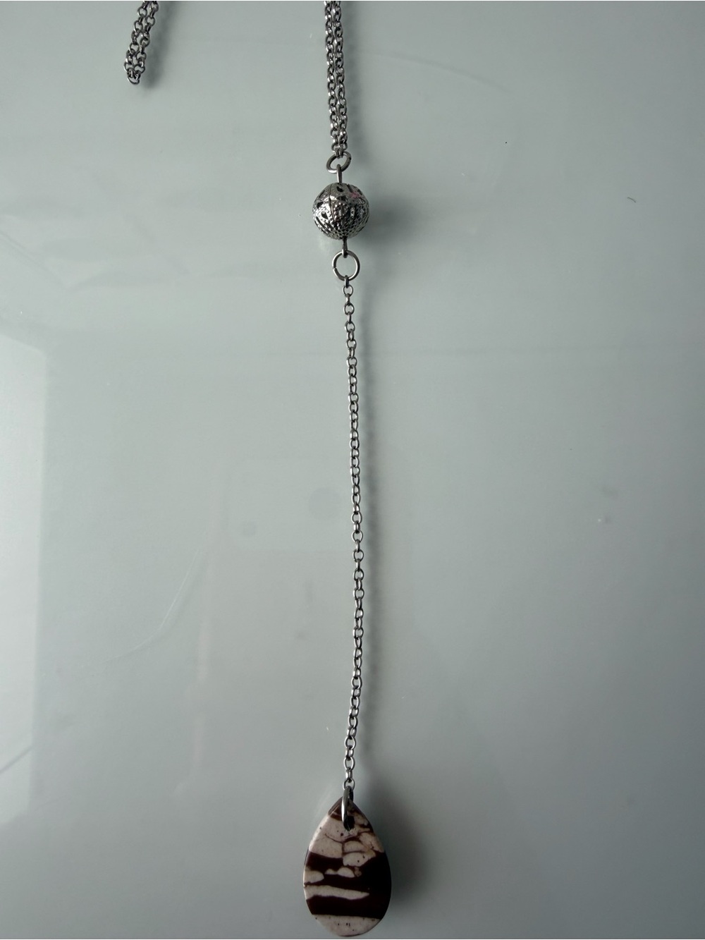Elegant Silver-tone Lariat Necklace with Brown & Cream Teardrop Pendant